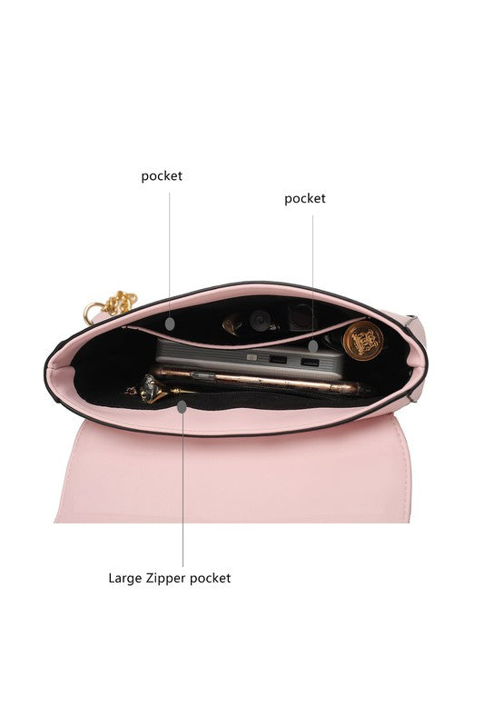 Inside of pink Nyra Quilted Shoulder Bag showing compartment and pockets.
