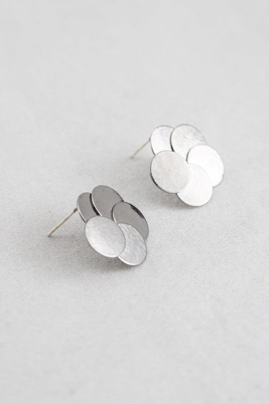 Round and Round Earrings in Gunmetal angled flatlay showing layered discs.