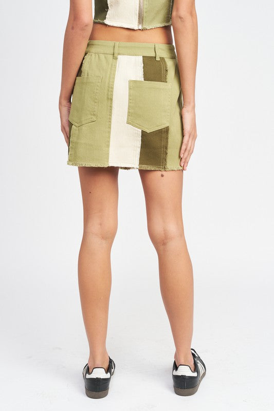 Back view of Kassiani Olive Combo mini skirt featuring high-rise fit, frayed seams, and clean panel design.