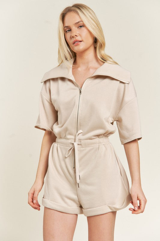 Clover Terry Zip Front Romper in beige, front view highlighting short sleeves and collar.