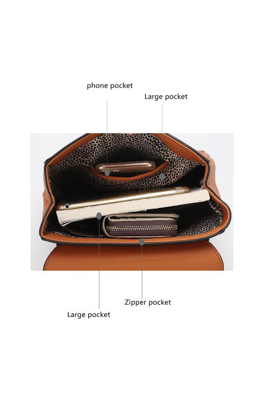 Inside view of brown Sansa backpack showing fabric lining, zip pocket, and slip pocket.