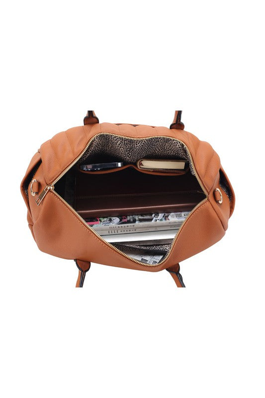 Open view of Luana Quilted Duffle Bag in Brown showing spacious compartment and pockets.