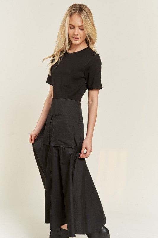 Side view of Felicity Knit Mix Dress in black with patch pockets and flowy midi skirt