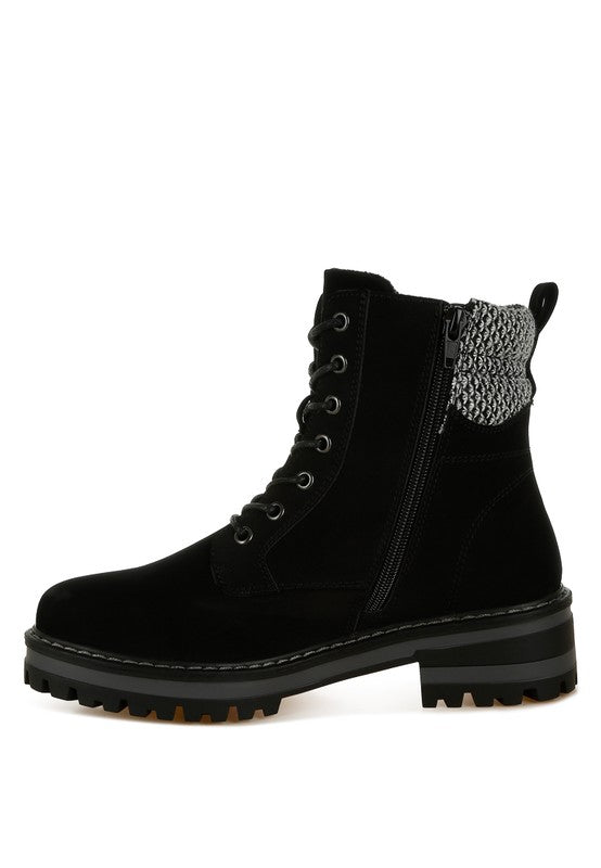 Side view of Black Mahisha Hiker Boots showing lug sole, chunky heel, and knitted collar contrast.