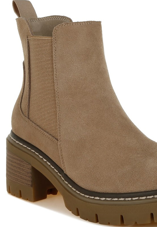 Detailed suede texture and elastic gusset on beige Chelsea boots