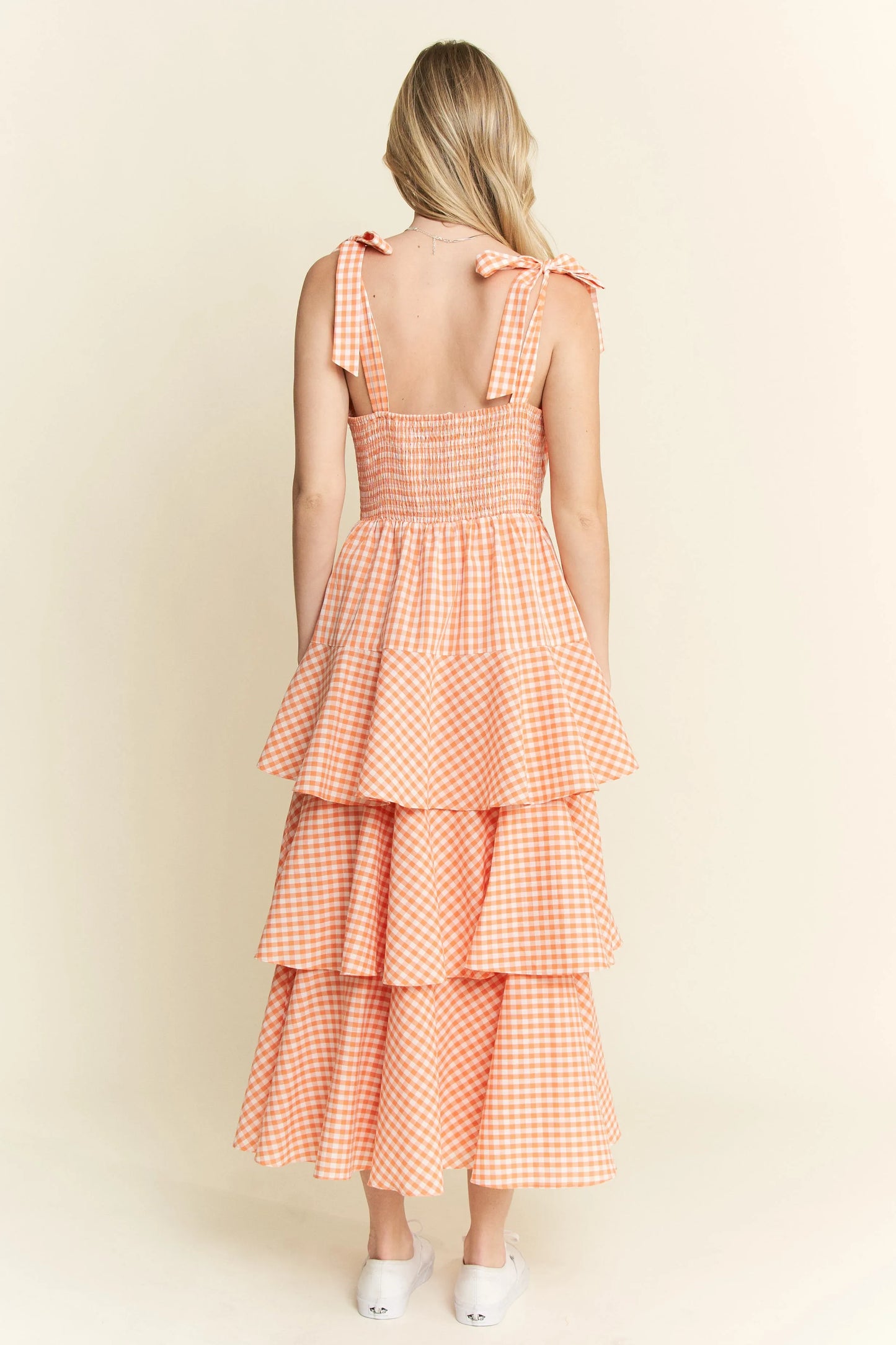 Back view of Alice Gingham Tiered Midi Dress by Jade by Jane, showcasing ruched back panel, halter tie straps, and tiered ruffle skirt design.