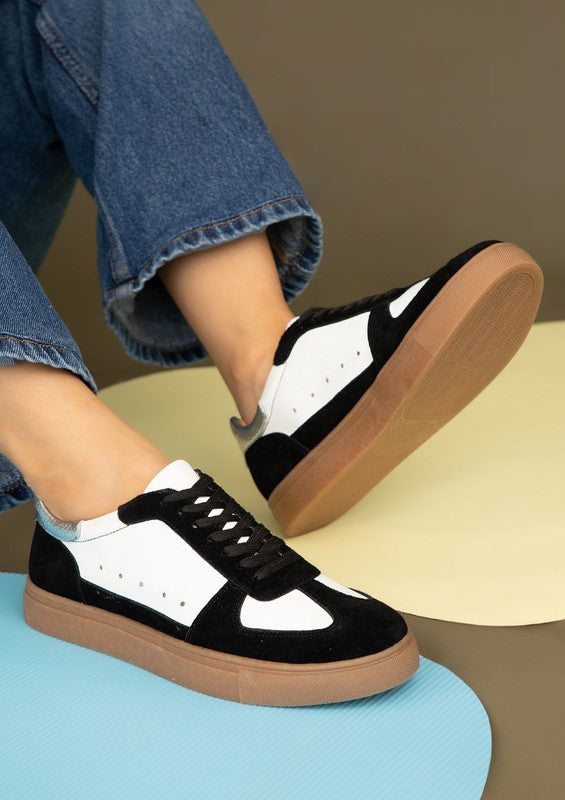 Black Sheena Lace Up Sneakers in leather and suede with round toe and white sole.