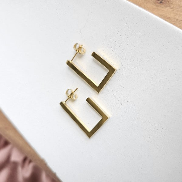 Goldi Luxe Gold Square Hoop Earrings on white background, 18K gold-plated stainless steel, modern geometric design.