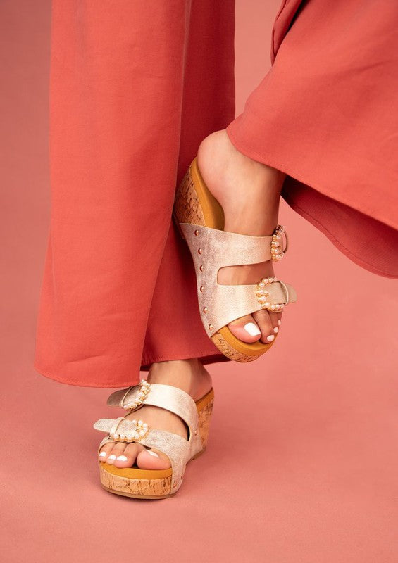 Gold Brianna Cork Wedge Sandal with open toe, cork heel, and adjustable closure.