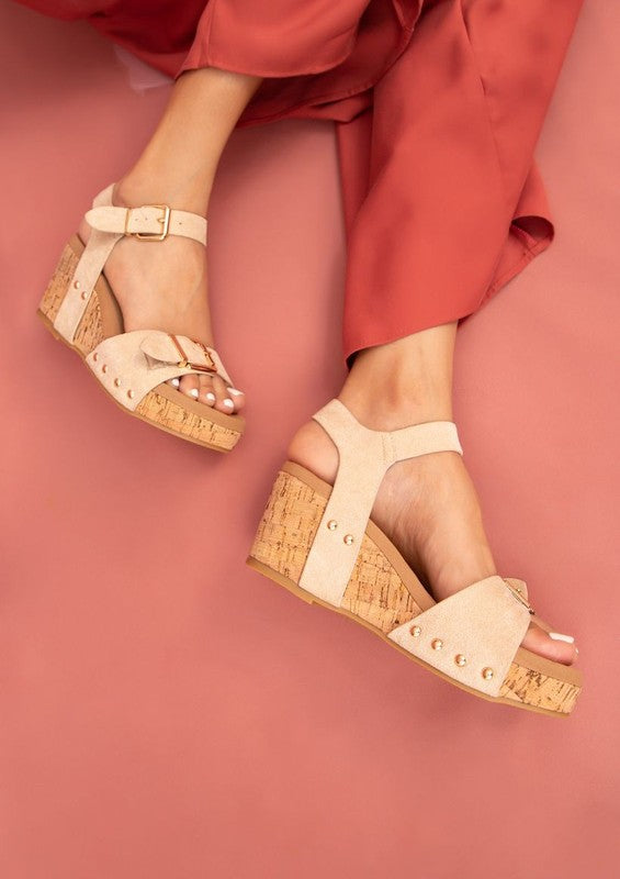 Nude Romy Platform Sandals with oversized buckles, cushioned wedge sole, and sleek center seam detail.