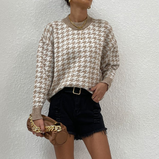 Front angled view of Delaney Khaki Houndstooth Sweater styled with shorts