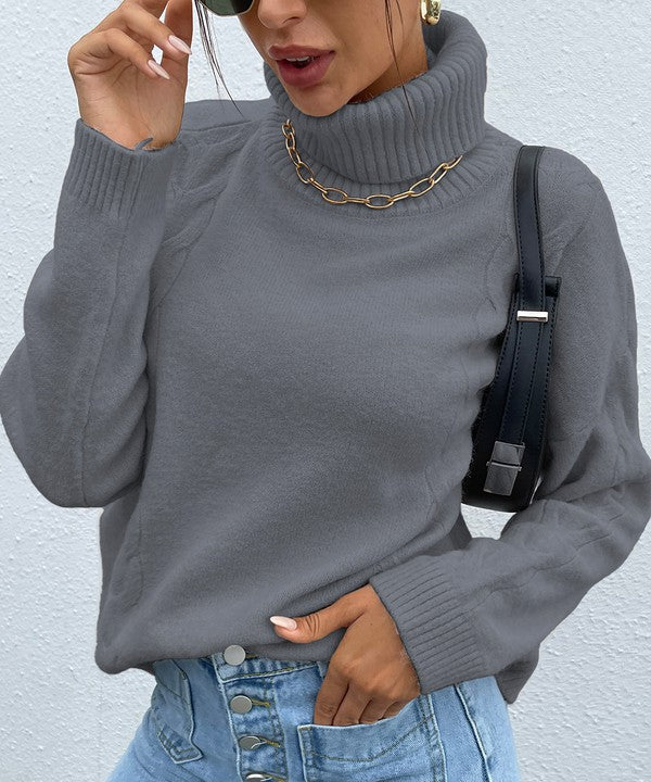 Front view of Wrently Grey Turtleneck Sweater with braided cable knit detail on sleeves and sides.