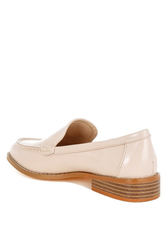 Back angle of Beige Corleone Vegan Leather Loafers showing low block heel and rubber sole.