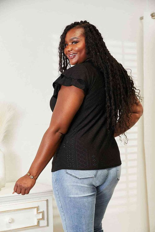 Plus size Tami black flutter sleeve top with eyelet detail and tie-neck for feminine charm.