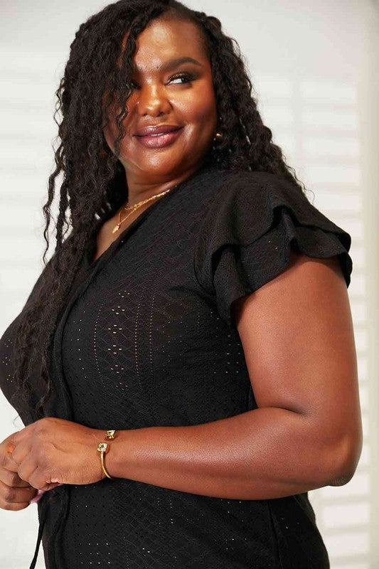 Black plus size flutter sleeve Tami Eyelet Tie-Neck blouse with breathable non-stretch fabric.