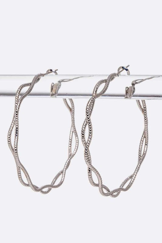 Rhodium Woven Iconic Hoop Earrings with sleek silver finish and woven detailing.