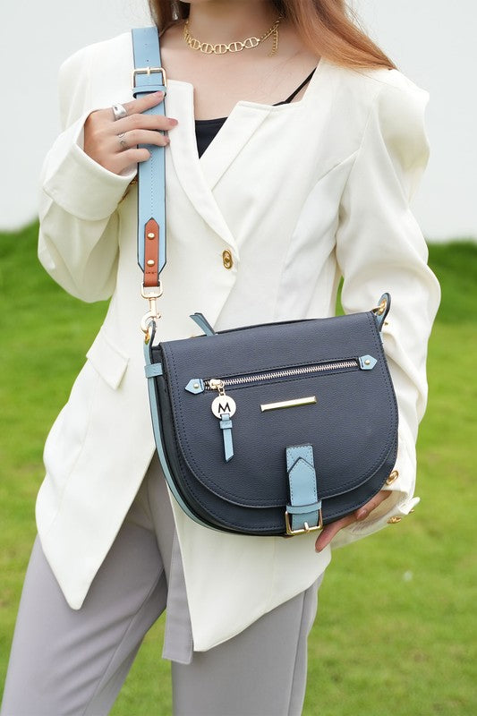 Woman wearing denim Drew Color Block Shoulder Bag crossbody style, featuring gold-tone hardware and adjustable strap.