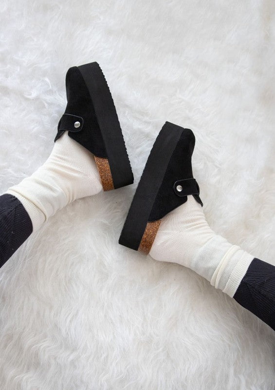 Backless design of black Jasmine Platform Clogs with adjustable silver buckle detail.
