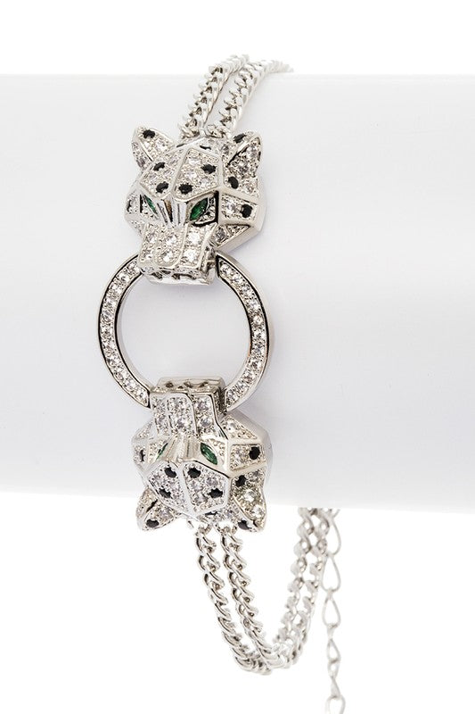 Itzayana rhodium-plated double leopard bracelet with cubic zirconia and circular ring centerpiece.