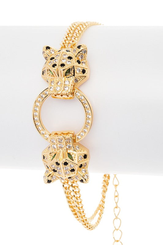 Itzayana gold-plated double leopard bracelet with cubic zirconia and circular ring centerpiece.