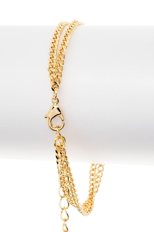 Back view of gold Itzayana double leopard bracelet with clasp and cubic zirconia leopard head details.