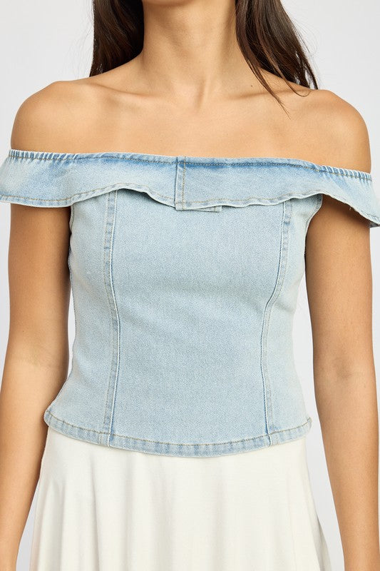 Close-up of Agnes off-shoulder denim bustier showing bustier seams and light-wash fabric texture.