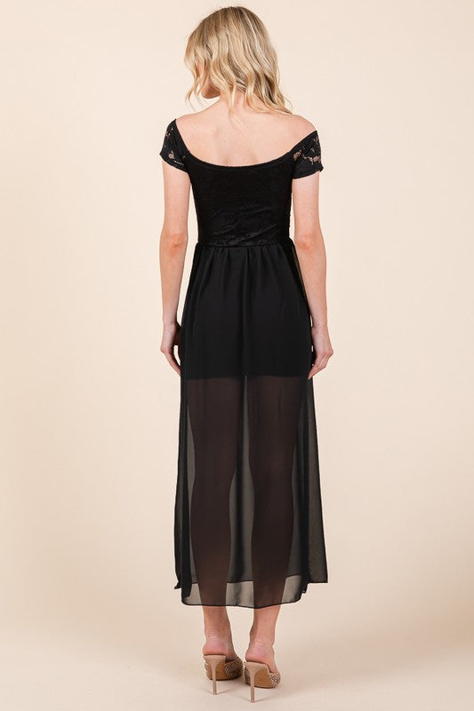Back of off-shoulder lace chiffon maxi dress with flowing skirt, designed for graceful movement at special events.