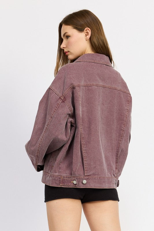 A rear shot displaying the oversized cut and relaxed fit, showing how effortlessly stylish and versatile this denim jacket is.
