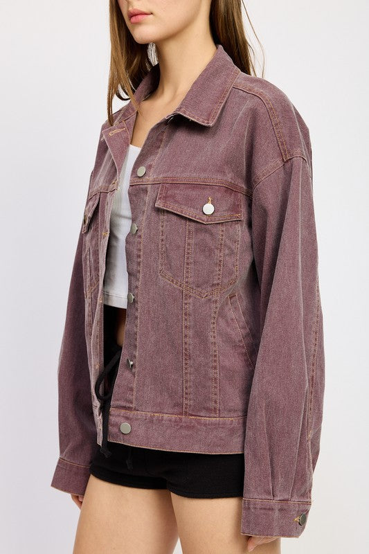 Close-up of berry denim jacket showing collar and silver buttons.