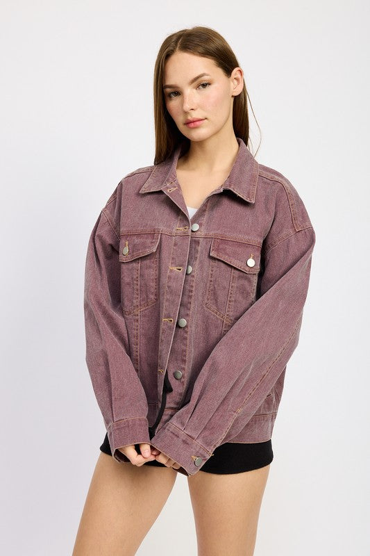 A trendy shot emphasizing the oversized silhouette and patch pocket details, making it the perfect casual layering piece.