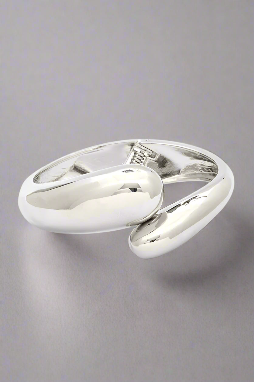 Polished Organic Hinged Bangle in silver, front view showing sculptural organic design.