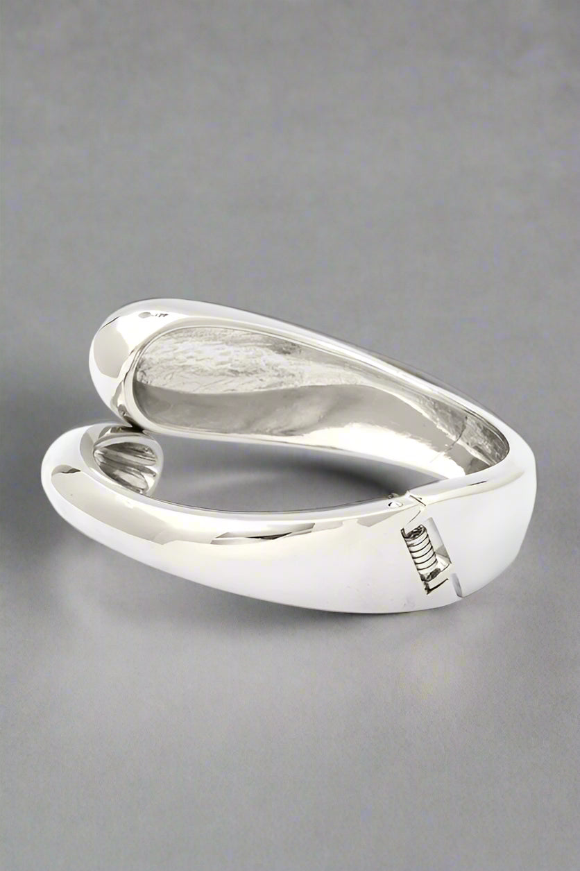 Polished Organic Hinged Bangle in silver, back view highlighting spring-hinged closure.