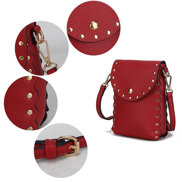 Close-up of Filomena crossbody bag buckle, gold hardware, rivets, and scalloped edges.