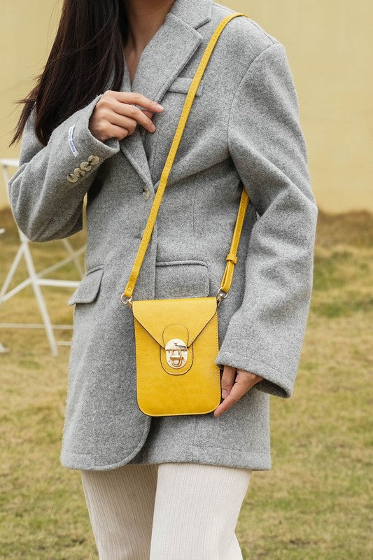 Woman wearing the MKF Havana Mustard crossbody bag styled for a casual, laid-back look.