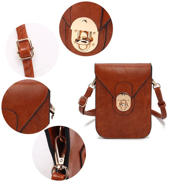 Close-up of MKF Havana crossbody bag showing buckle strap, stitching details, twist lock, and gold-tone hardware.