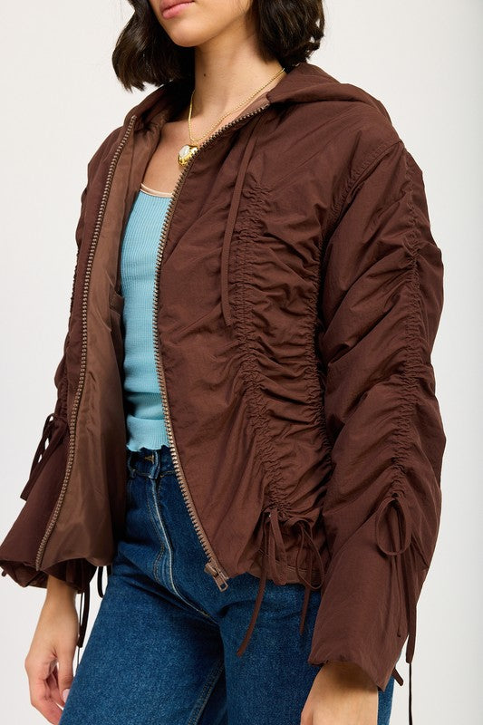 Candes Ruched Puff Jacket in brown side close-up with ruching