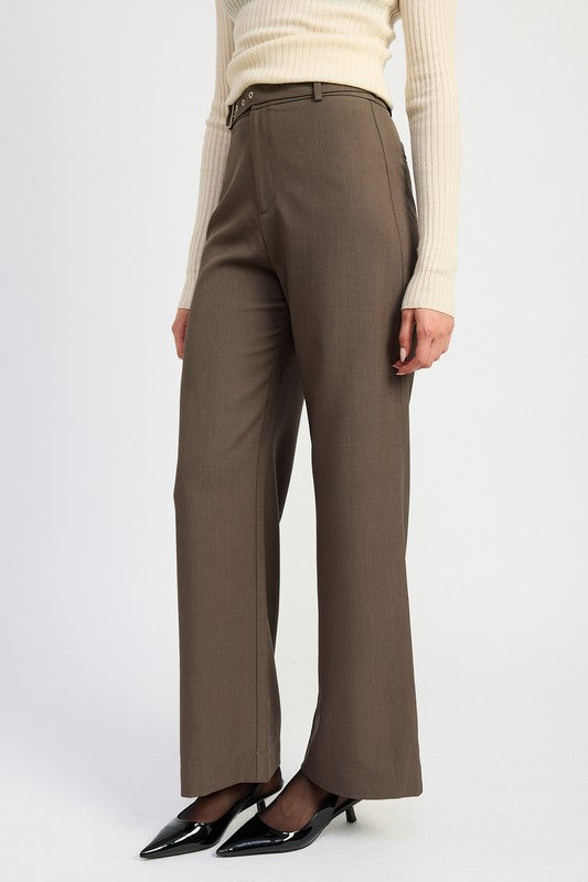 Side view of Tricia ash-brown trousers highlighting gold buckle waistband and smooth fit.