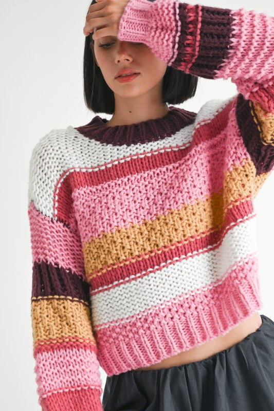 Close up of Kai Mock Neck Striped Sweater showing chunky knit and bold stripes
