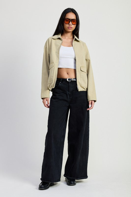 Full body view of Aylin Long Sleeve Denim Jacket in sand styled casually with trousers
