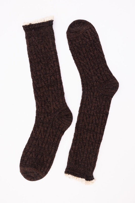 Samara Ribbed Ruffle-Trim Socks in dark brown cotton with ribbed knit texture and feminine ruffle trim detail.