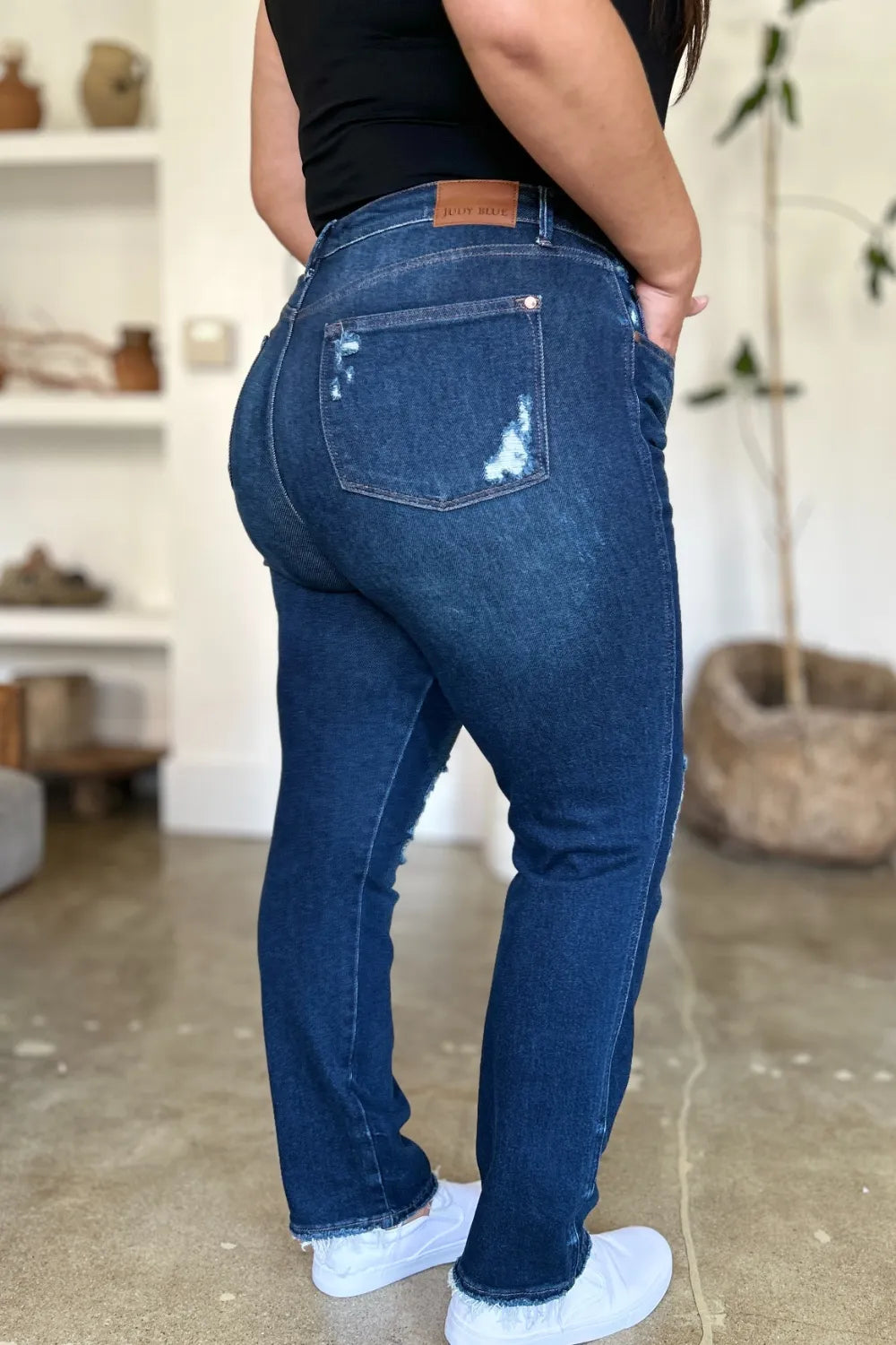 Plus size model in Wynna Straight Jeans, high waist fit and Judy Blue logo tag on back