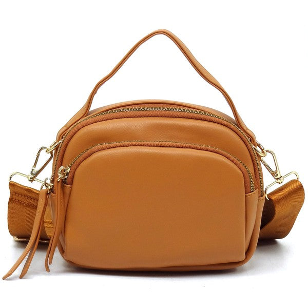 Front view of the tan Cadie Top Handle Crossbody Bag with gold-tone hardware, structured top handle, and zip-top closure