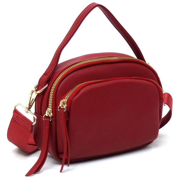 Angled view of the red Cadie Top Handle Crossbody Bag highlighting gold-tone hardware and sleek silhouette