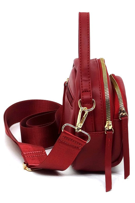 Side view of the red Cadie Top Handle Crossbody Bag showing structured shape and gold-tone accents