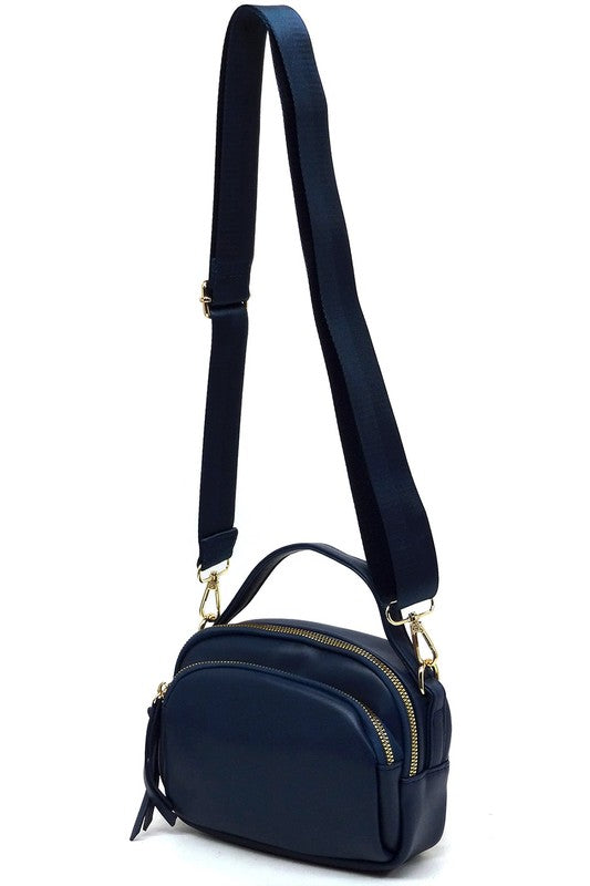 Blue Cadie Crossbody Bag with gold-tone hardware, zip-top closure, and detachable shoulder strap for versatile wear