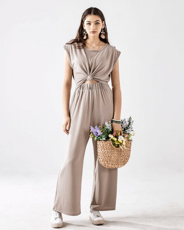 Full body front view of Kora Wide Leg Jumpsuit in light mocha with twist-front.