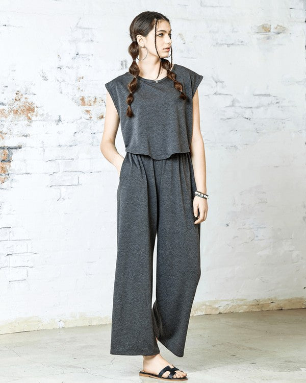 Front view of Kora Wide Leg Jumpsuit in charcoal gray with layered effect.