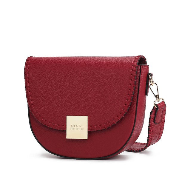 Red Isa crossbody bag with structured design and smooth vegan leather.