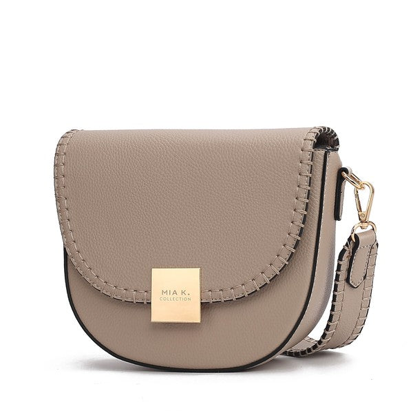 Taupe Isa crossbody bag with adjustable strap and polished gold-tone closure.