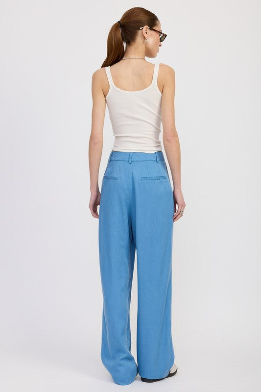 Back view of Poppy High Waist Wide-Leg Trousers in chambray showing high waist fit